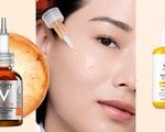 A woman applying face serum to skin
